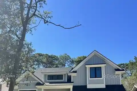 Golf Course Retreat Featuring Fireplace and Wood Ceilings