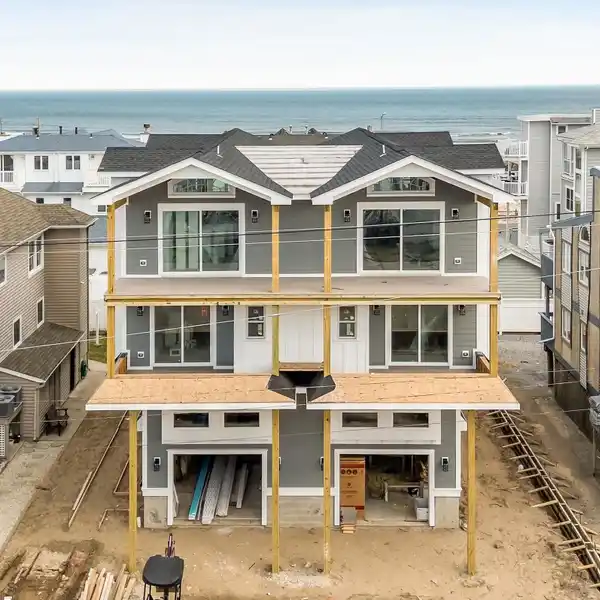CUSTOM COASTAL RETREAT STEPS FROM THE BEACH