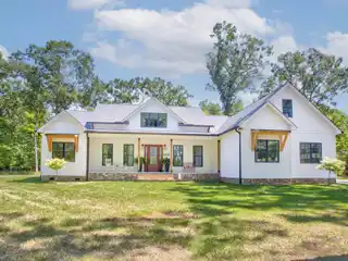 Modern Design and Rustic Charm over 11 Acres of Lush Landscape