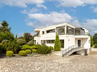 Spacious Home Surrounded by Private Wooded Grounds