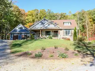 Stunning Custom Home on Five Private Wooded Acres