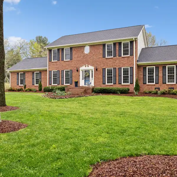 ALL-BRICK COLONIAL ON A METICULOUSLY LANDSCAPED LOT