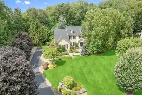 Timeless Center-Hall Colonial Set on Beautifully Landscaped Grounds