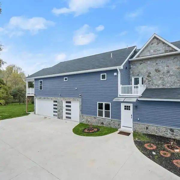 EXCEPTIONAL CONTEMPORARY COLONIAL ON A SERENE HALF-ACRE