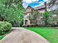 STUNNING ENGLISH COUNTRY MANOR HOME ON A PRIVATE ONE ACRE HILLTOP LOT