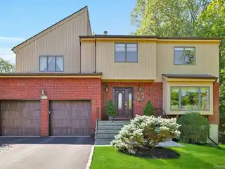 Contemporary Colonial in a Park-Like Setting