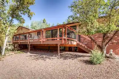 Custom Rancher Nestled Among Towering Pines