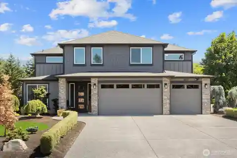 Stunning Estate Nestled on a Beautifully Landscaped Acre