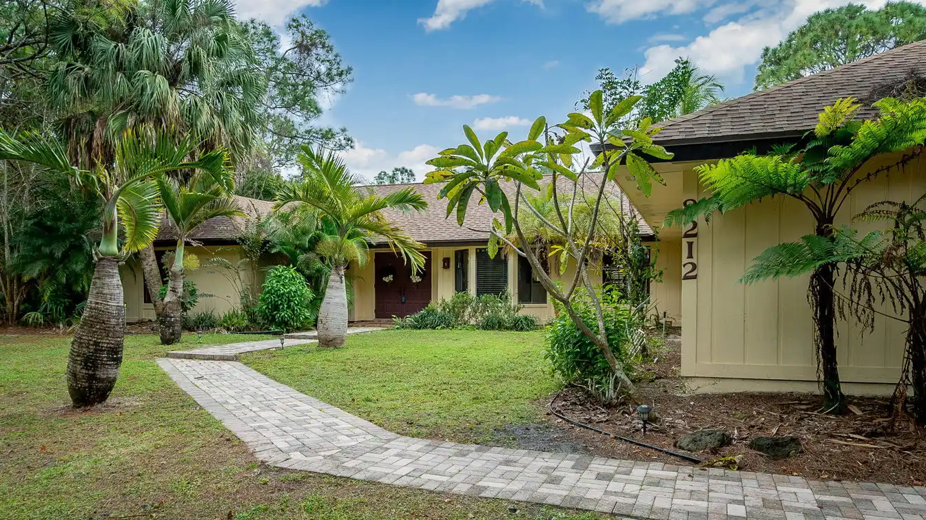 Rare Canal-front Find in Palm Beach Country Estates