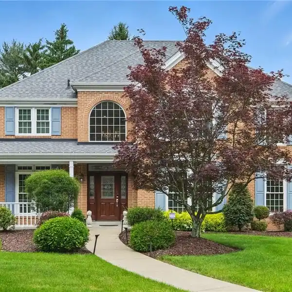 THOUGHTFULLY UPDATED CLASSIC BRICK COLONIAL