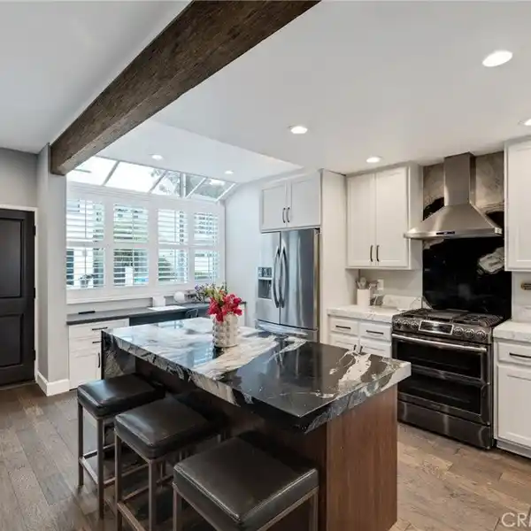 EXTENSIVELY RENOVATED TOWNHOME BLOCKS FROM THE SAND