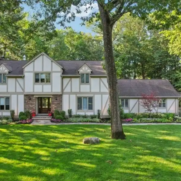 METICULOUSLY MAINTAINED TUDOR-STYLE RESIDENCE
