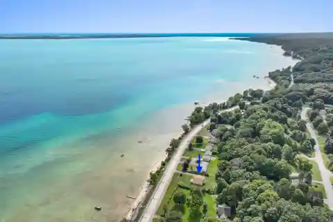 Beautifully Styled Retreat with 100 Feet of Private Sandy Frontage