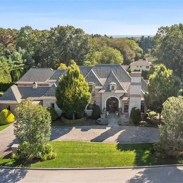 CUSTOM BRICK & STONE MASTERPIECE WITH 5 ENSUITE BEDROOMS