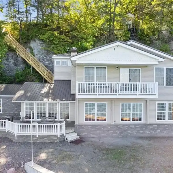 TURNKEY HOME WITH BEACHFRONT ON CAYUGA LAKE