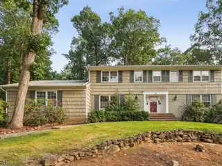 Lushly Landscaped Colonial with Glass Breakfast Room