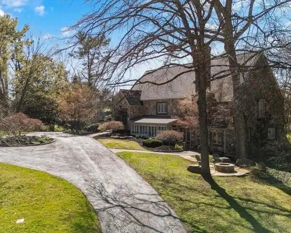 TUDOR-STYLE ESTATE WITH TIMELESS ELEGANCE