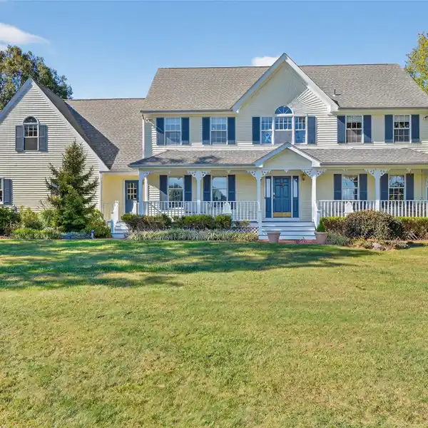 CLASSIC COLONIAL WITH ROCKING CHAIR FRONT PORCH