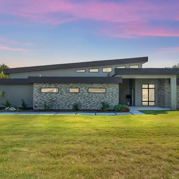 CONTEMPORARY LIVING ON A WOODED CORNER LOT