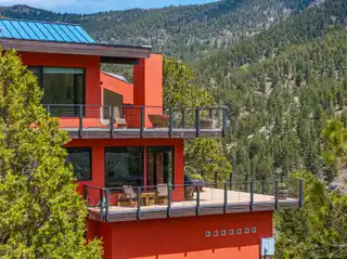 Eco-modern Escape with Forest, Stream, and Pond