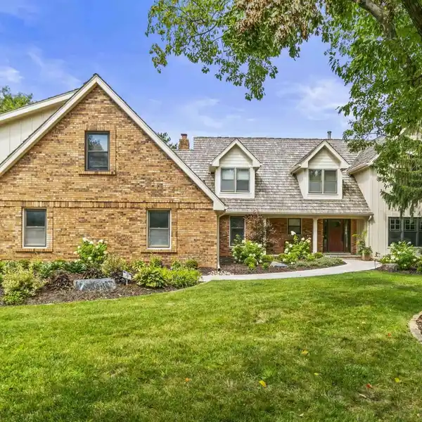 ELEGANT TWO-STORY HOME WITH FOUR-CAR GARAGE