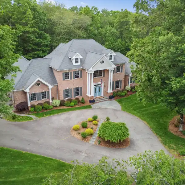 EXQUISITE BRICK COLONIAL WITH LUXURIOUS UPGRADES