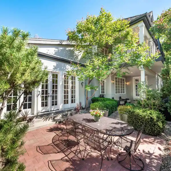 FRENCH TUDOR-INSPIRED HOME IN A SOUGHT-AFTER NEIGHBORHOOD