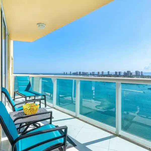BEAUTIFULLY ENHANCED END UNIT WITH PANORAMIC OCEAN VIEWS