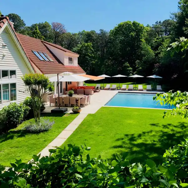 EXTENSIVELY RENOVATED AND EXPANDED HOME ON MANICURED GROUNDS