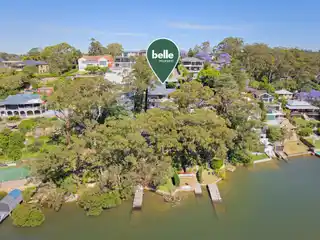 Architectural Waterfront Retreat with City Skyline Views