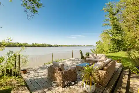 Vast Stone House Nestled on the Banks of a River