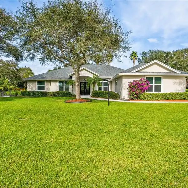 IMMACULATE ONE-OWNER CUSTOM HOME IN A PEACEFUL SETTING