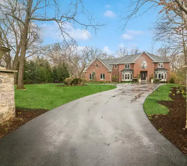 LUXURY LIVING IN 1.8 WOODED ACRES