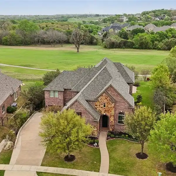 STUNNING EXECUTIVE POOL HOME IN IDEAL TROPHY CLUB LOCATION