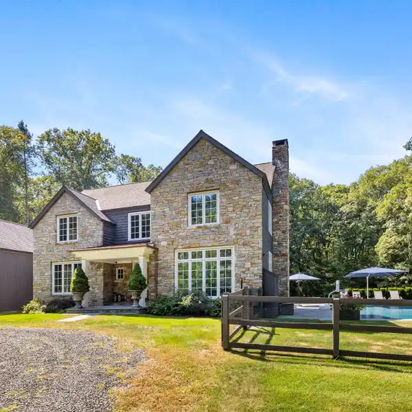 DISTINCTIVE HOME ON SIX PRIVATE ACRES