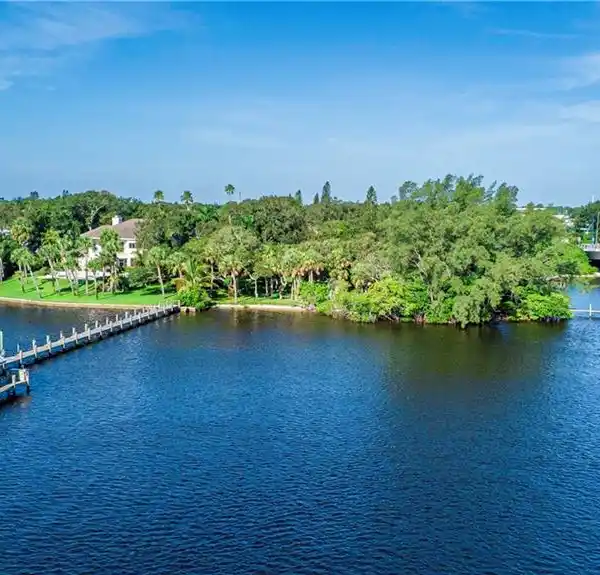 RARE RIVERFRONT PROPERTY WITH PRIVATE BEACH