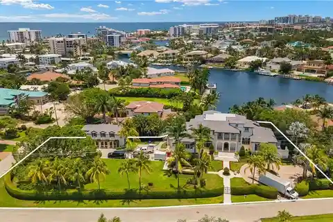 Fully Reimagined Estate on a Rare Corner Waterfront Lot