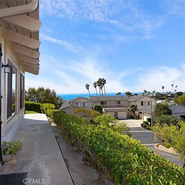 SPACIOUS CONDO WITH GLASS SLIDERS AND COASTAL VIEWS