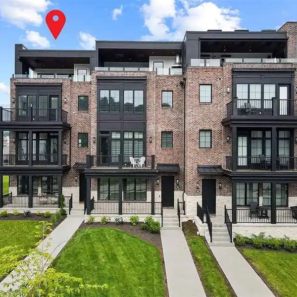 LUXURY BROWNSTONE LIVING AT THE RIVER’S EDGE