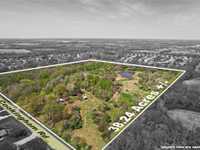 BEAUTIFUL FARMHOME ON EXPANSIVE ACREAGE