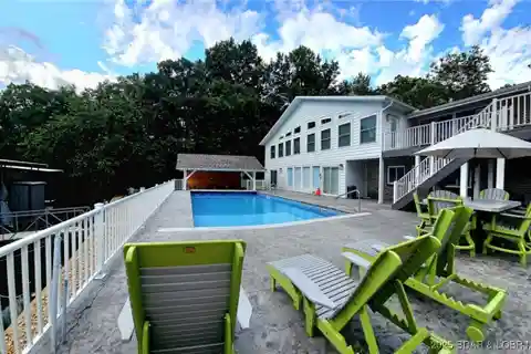 Gated Lakefront Retreat with Entertainer’s Dream