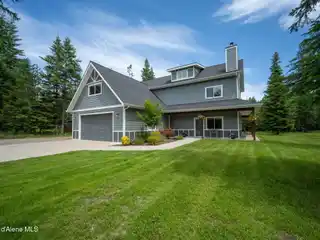 Grand Home with Wraparound Porch and Workshop