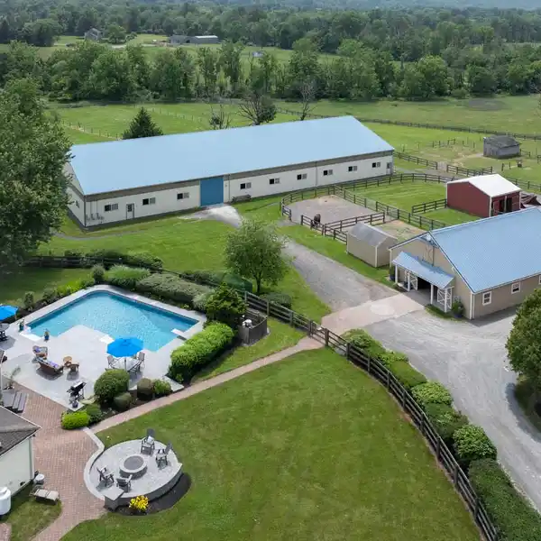 NEARLY 11-ACRE EQUESTRIAN FACILITY WITH UPDATED COTTAGE-STYLE HOME