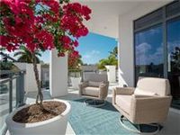 AN EXCEPTIONAL RESIDENCE WITH AN EXPANSIVE WRAPAROUND BALCONY