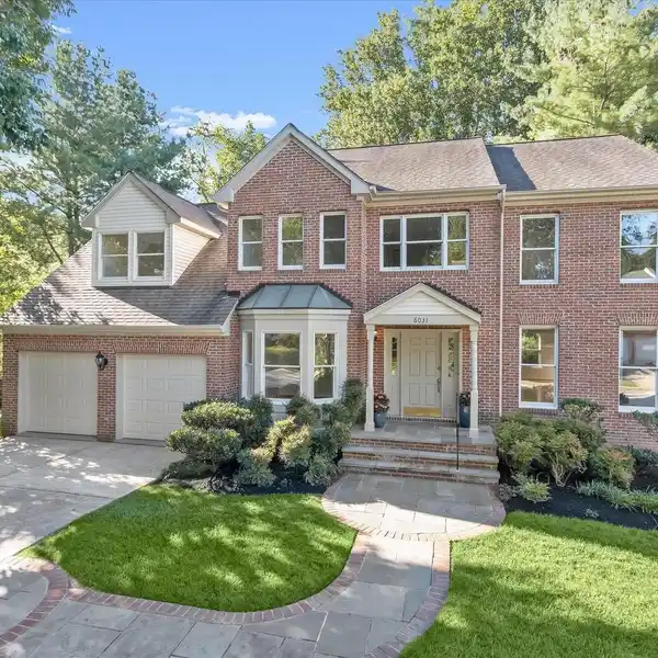 BEAUTIFUL BRICK-FRONT HOME ON A WOODED LOT