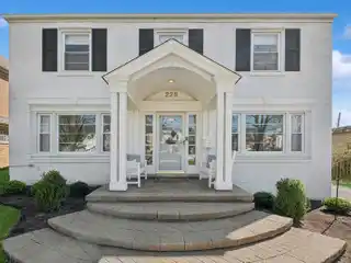 Stunningly Updated White Painted Brick Colonial