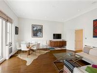THIS GENEROUSLY PROPORTIONED FLAT OFFERS EXQUISITE OPEN VIEWS ACROSS THE LONDON SKY LINE