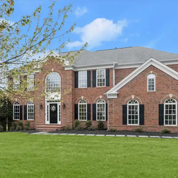 STUNNING TWO-STORY HOME IN SERENE SETTING