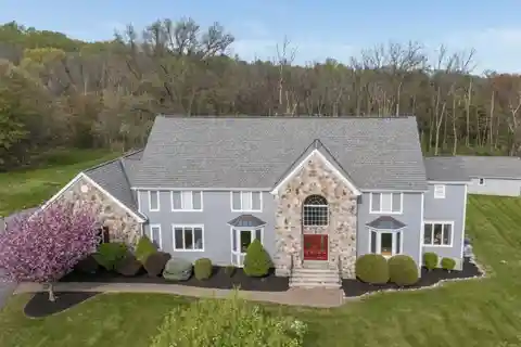Elegant Colonial Retreat on Private Wooded Acreage