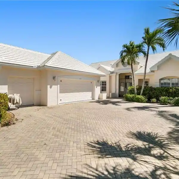 IMMACULATELY MAINTAINED HOME WITH SWEEPING GOLF AND LAKE VIEWS